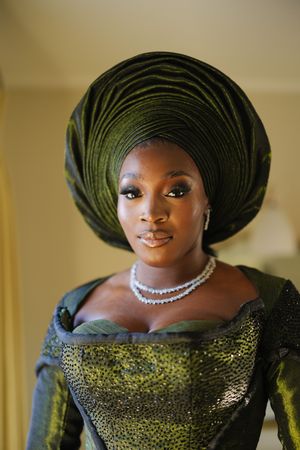 Traditional African attire showcased in a series of closeup shots featuring dark green headwrap and sparkling formal dress details.