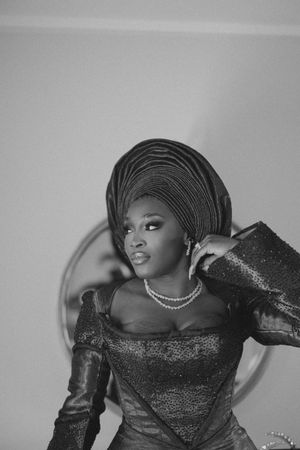 A black and white artistic portrait featuring glamorous fashion poses in sequined formalwear.