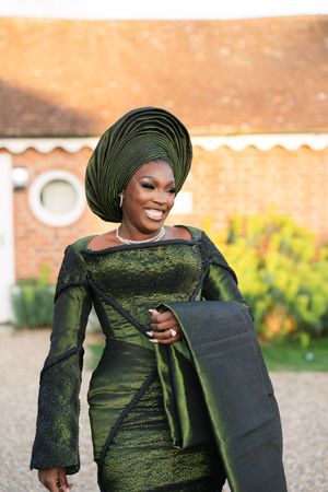 A series of fashion photos showing a shimmering green dress with long sleeves and matching head wrap against a warm sunset.
