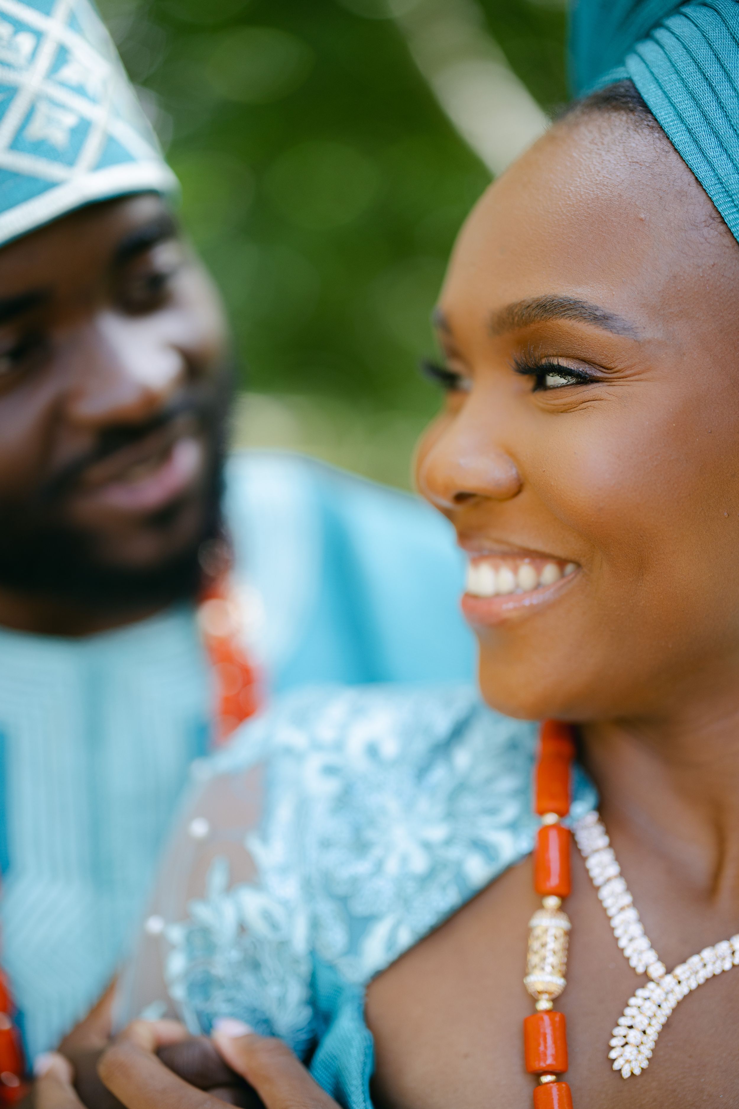 Close-up profile view of couple wearing traditional African wedding attire.