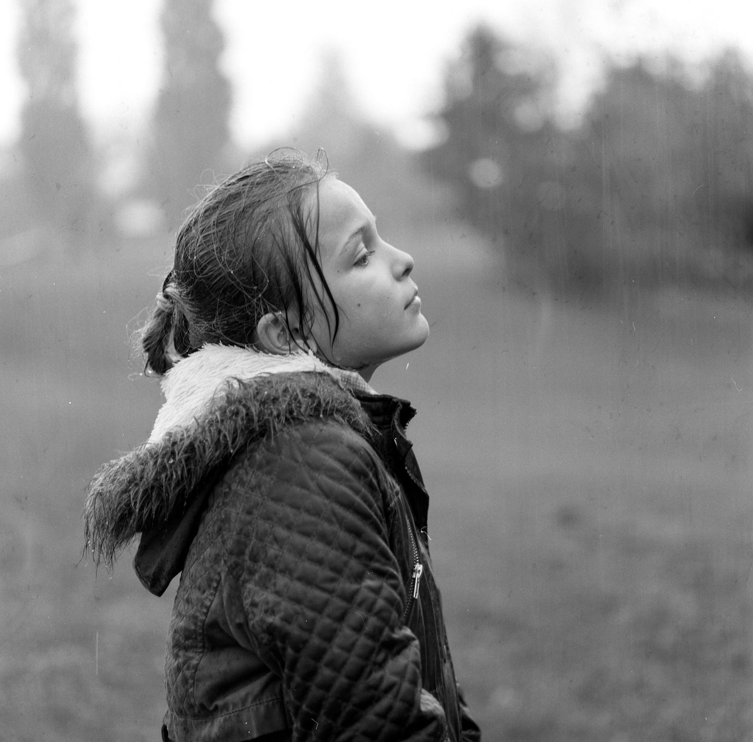 Little Girl Photographed in the Rain