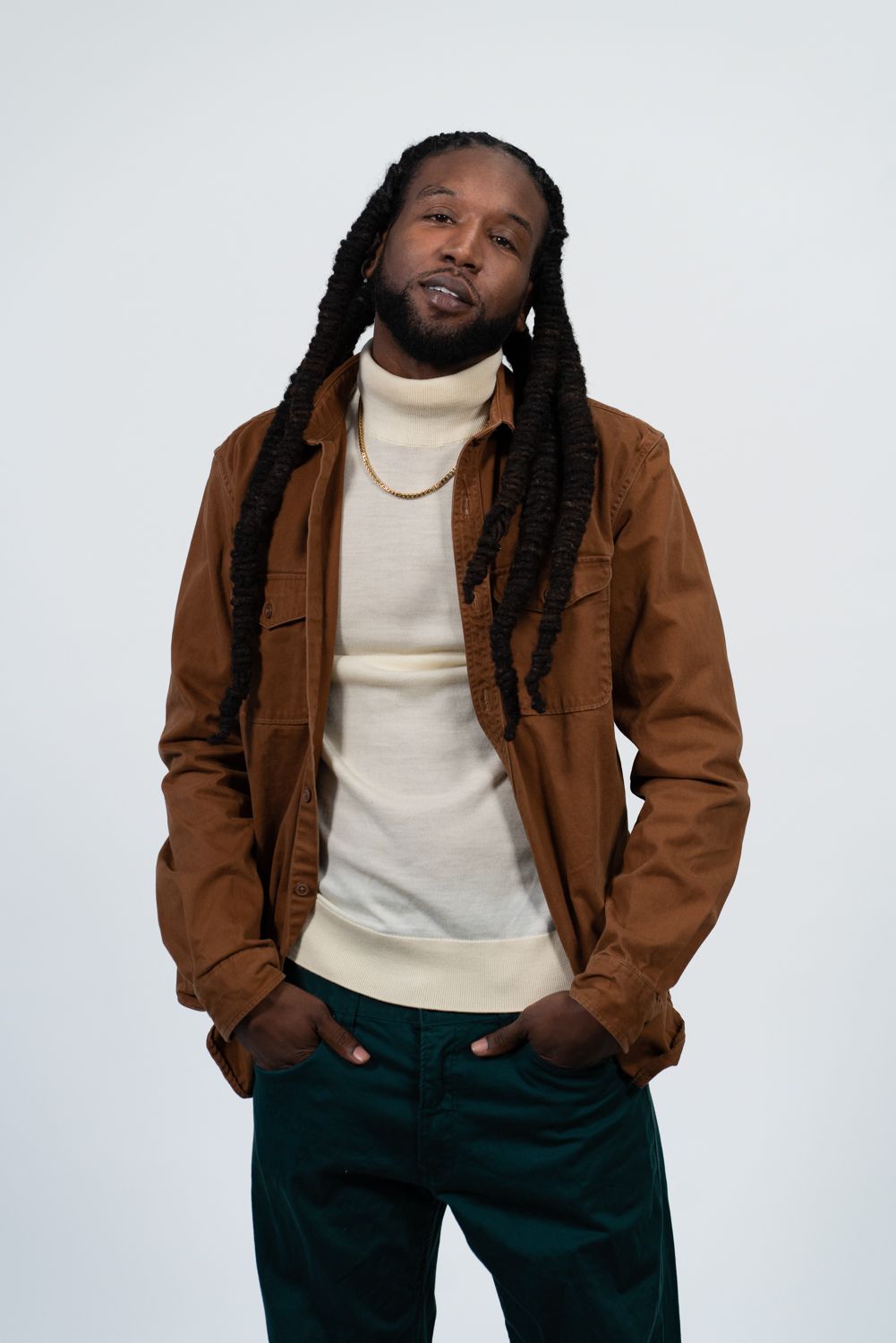 Studio portrait series showing a model in a brown jacket and cream turtleneck against a white background.