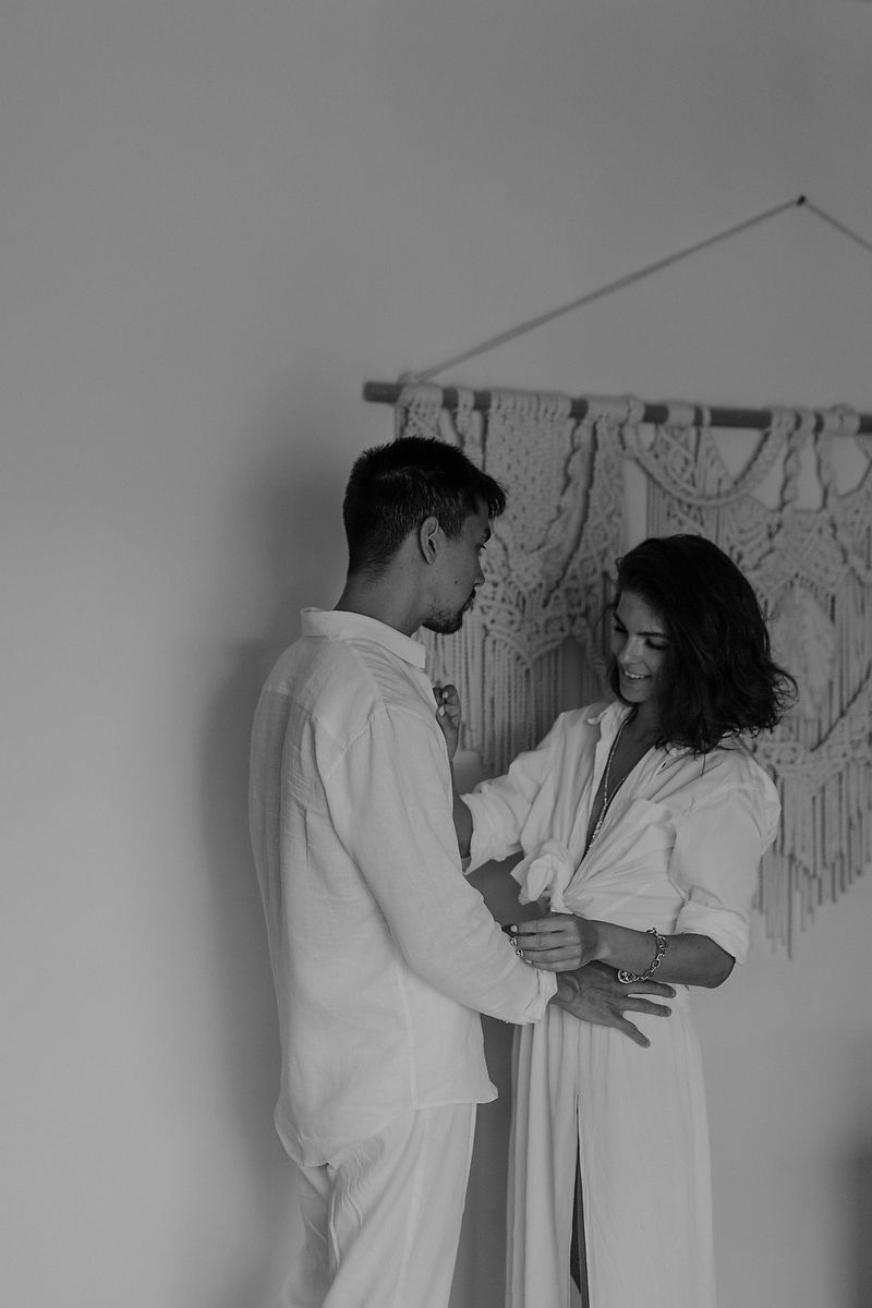 Bride and groom holding hands indoors during intimate Tulum elopement Riviera Maya wedding photographer.