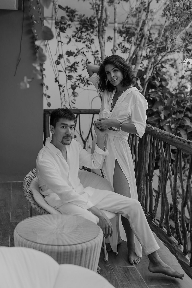Bride and groom seated together on balcony during intimate Tulum elopement Riviera Maya destination wedding.