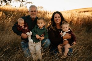 A series of candid outdoor family portraits captured in a golden wheat field at sunset.