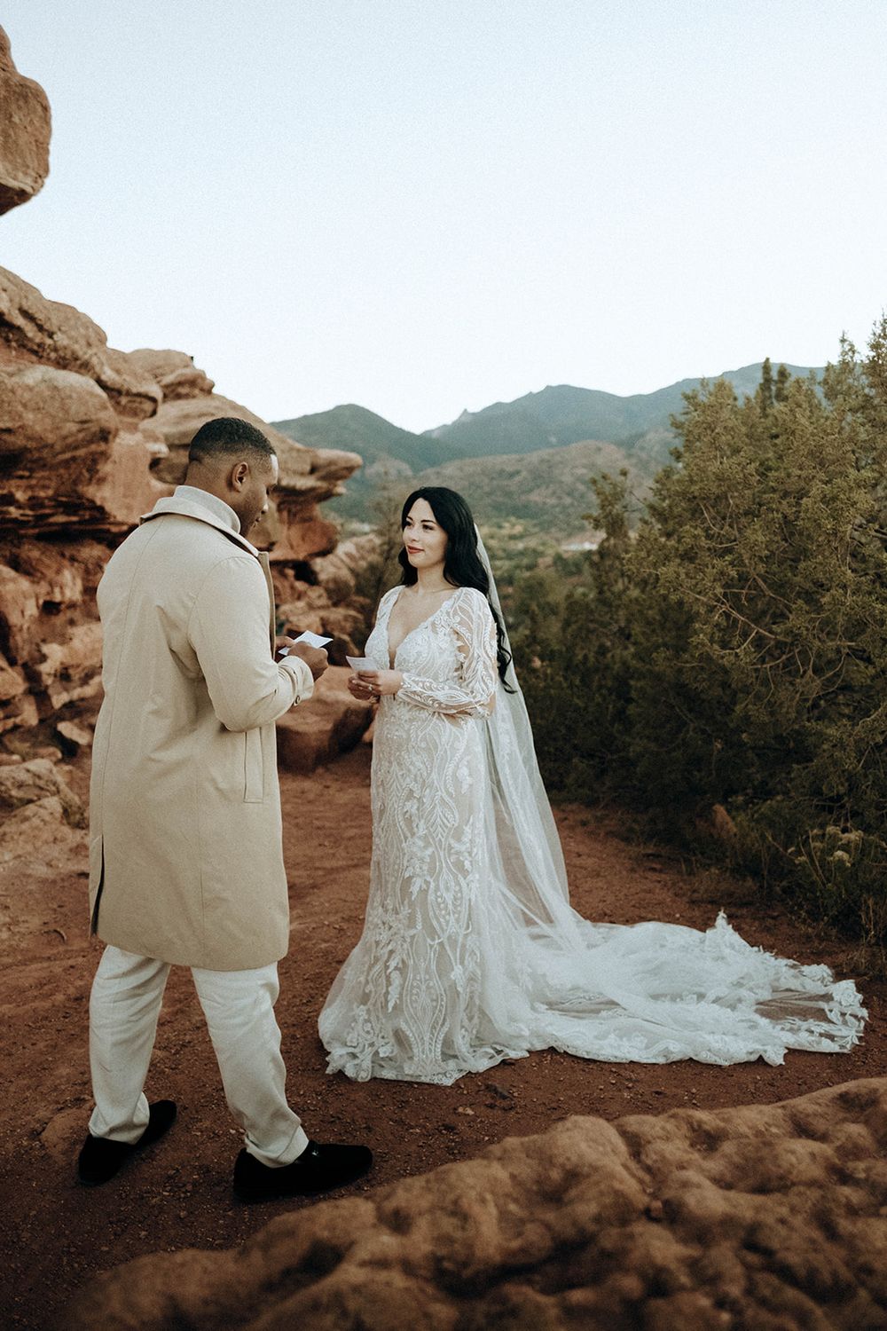 Bride and groom exchange vows at scenic Red Rocks Colorado elopement at sunset.
