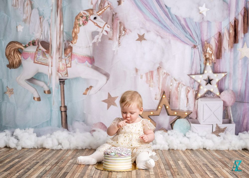 Magical carousel-themed birthday setting with wooden floor and pastel decorations.