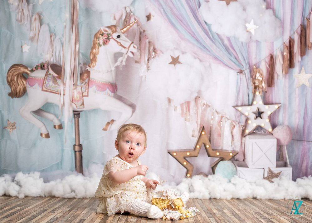 Whimsical nursery scene with carousel horse and star decorations on pastel backdrop.