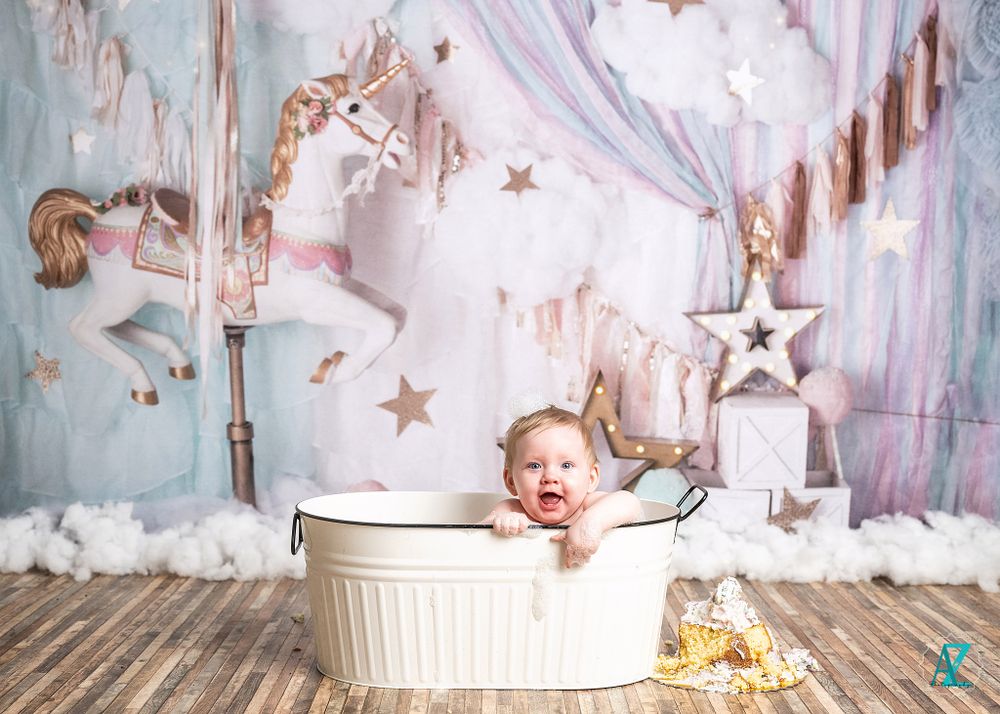 Sweet bathtub portrait with magical carousel and star themed background.