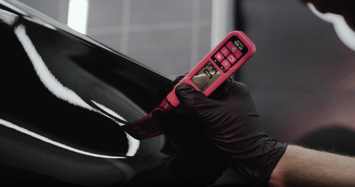 Measuring paint thickness on a vehicle panel