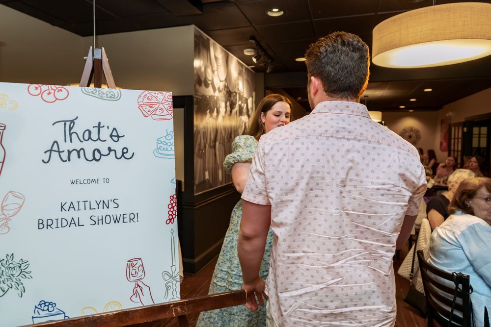 Decorative signs and banners displayed at a bridal shower party.