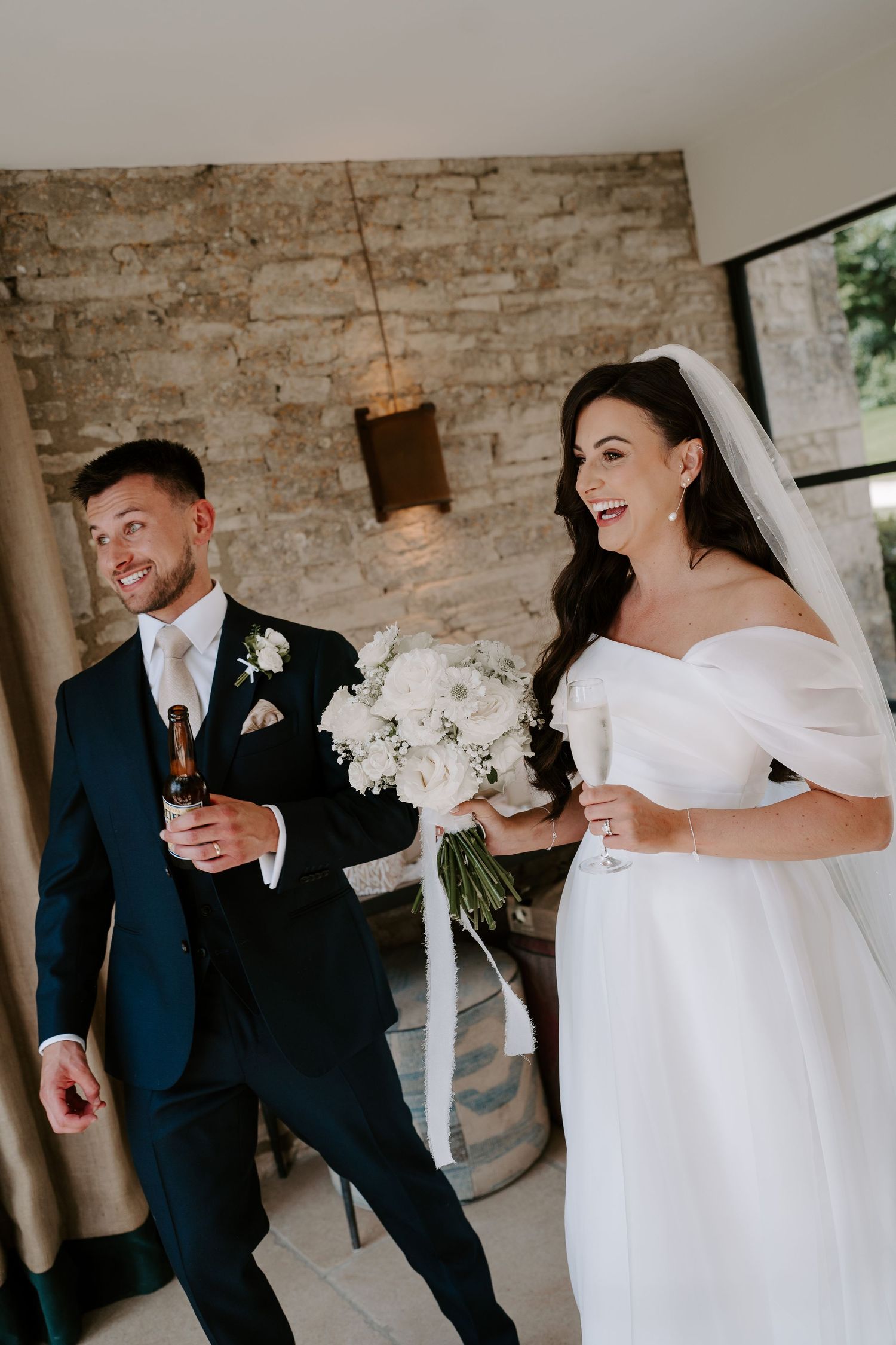 bride and groom laughing after ceremony at yardspace old gore in cirencester