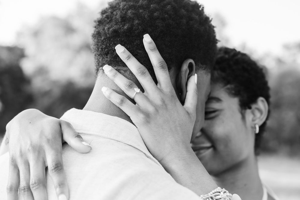 A series of intimate black and white photographs showing tender moments between a couple on their wedding day.
