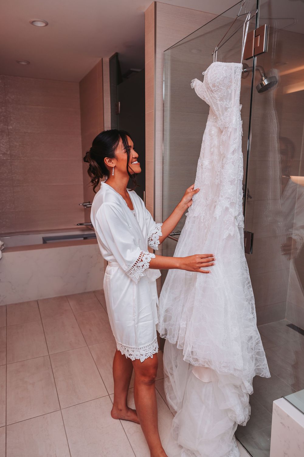 A sequence of photos showing someone in a white robe handling a flowing white wedding dress in a bathroom setting.