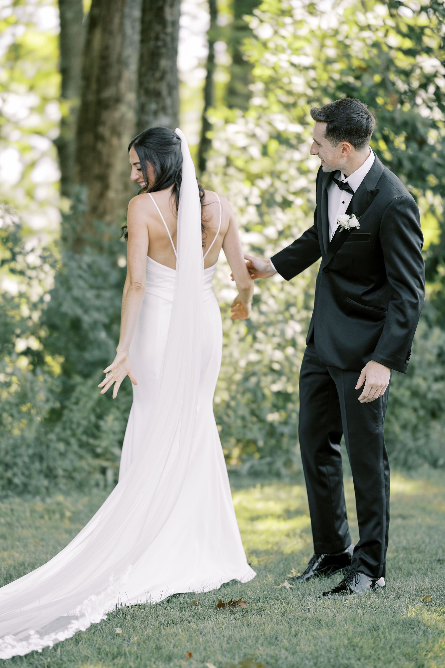 A series of playful first look wedding photos captured in a natural outdoor setting.
