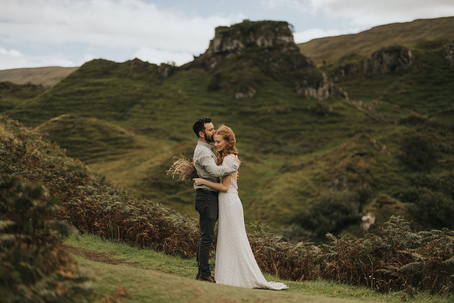 Scottish Highlands wedding photography captures romantic moments against dramatic mountainous landscapes and rugged terrain.