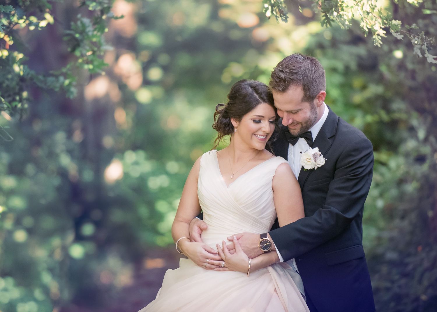 Elegant couple enjoy a moment of love in a garden after ceremony
