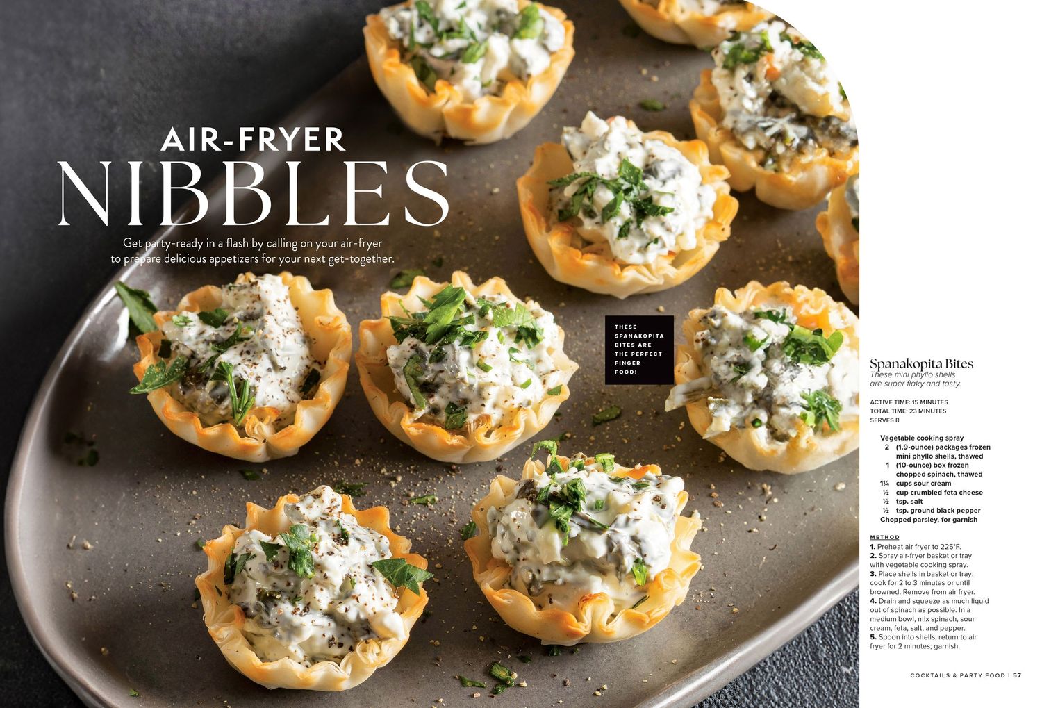 Air fryer appetizers with creamy toppings and herbs arranged on a dark plate.