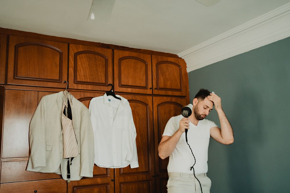The groom getting ready, a moment of excitement before the wedding