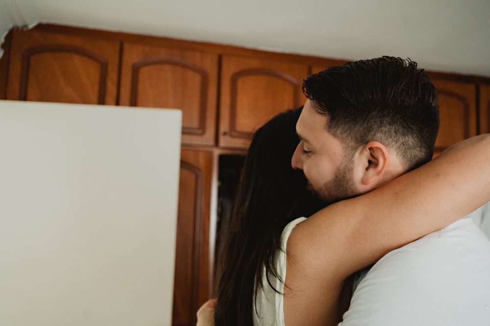 Sister hugging her brother (the groom) before the ceremony, an emotional moment