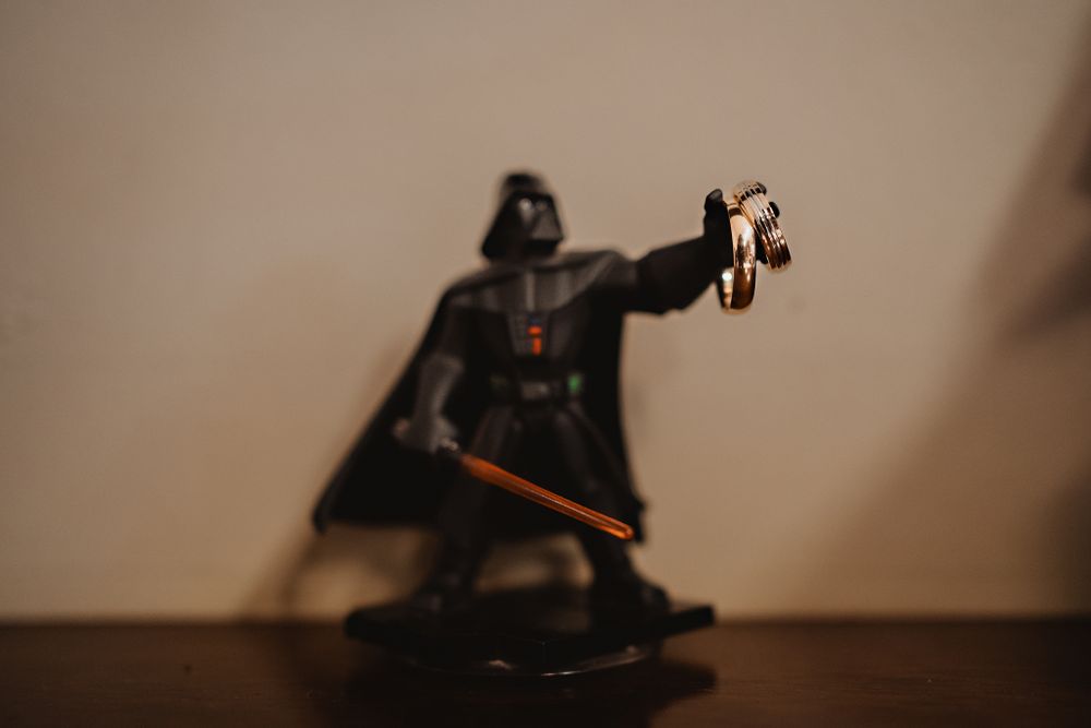 Darth Vader holding the wedding rings, adding a fun touch to the ceremony