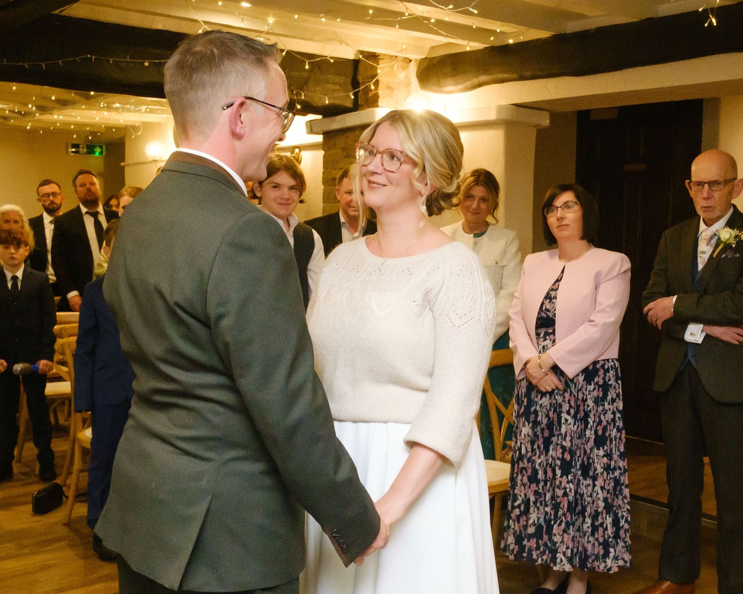 Bride wearing her late mothers knitted jumper on her wedding day