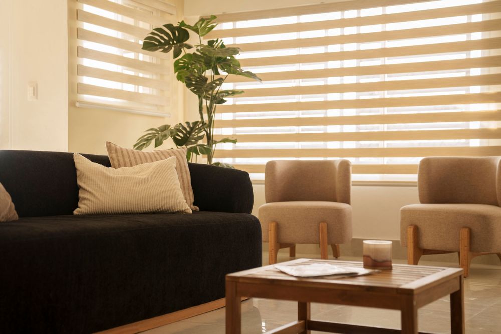 Contemporary living space with striped window treatments and modern furnishings.