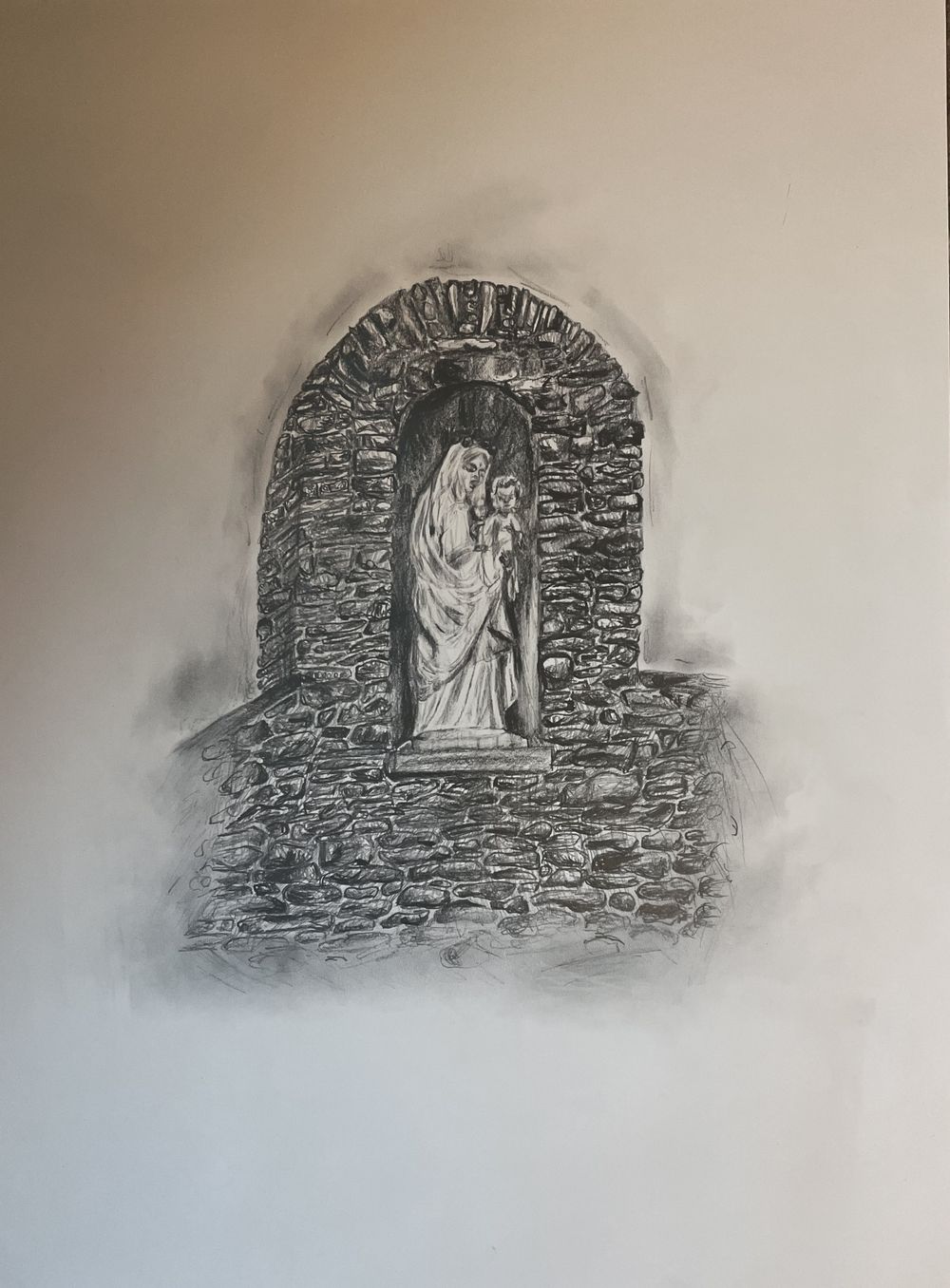 Charcoal sketch of a stone archway with a religious figure inside.
