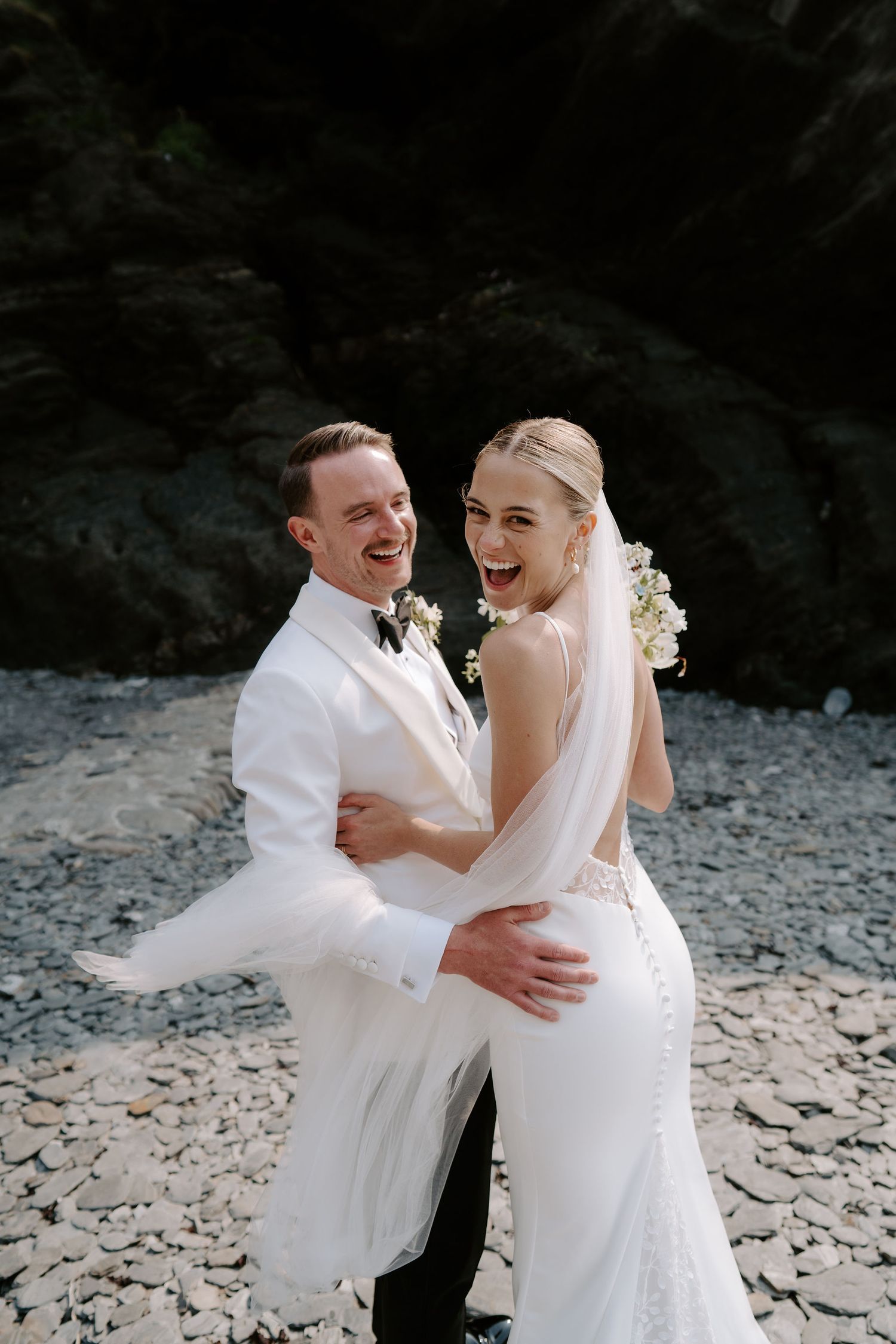 Bride and Groom on beach at Tunnels beach wedding venue in north devon