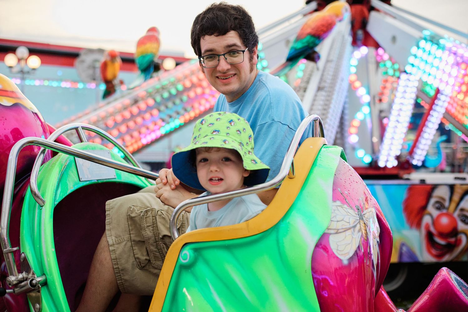 Colorful amusement park ride scene with riders enjoying a vibrant attraction.