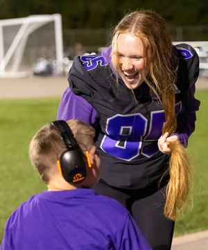 Energetic interaction between player and coach during a football game.