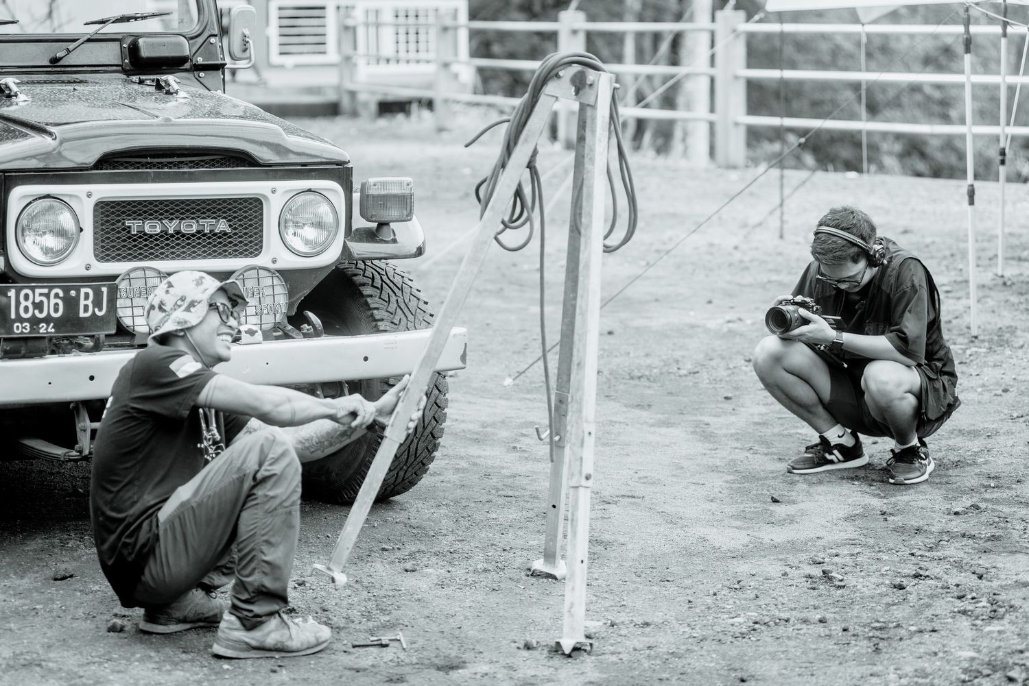 Vintage black and white photographs showing multiple people crouching and aiming rifles at targets during a shooting competition.