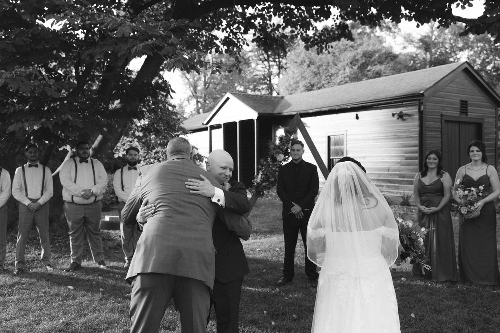 A collection of vintage black and white wedding photographs showing couples and guests celebrating outdoors.