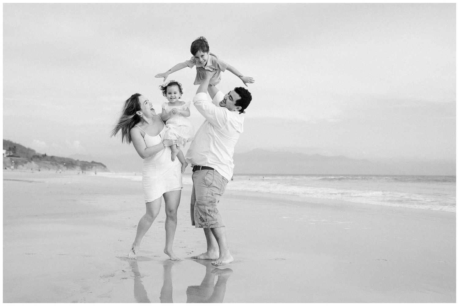 Sayulita family photography, couple dancing together on a beach at sunset during a golden hour photoshoot.