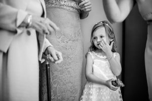 Candid black and white wedding moment showing reactions and emotions.