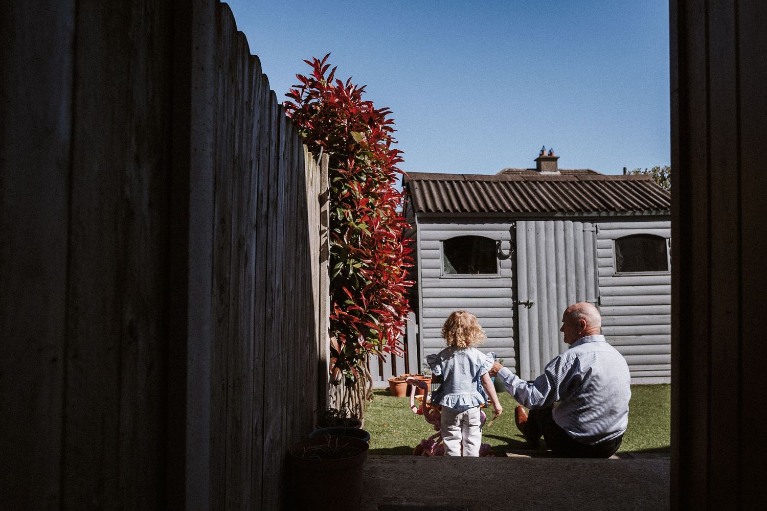 A series of photos showing people walking between mobile homes in a trailer park community.