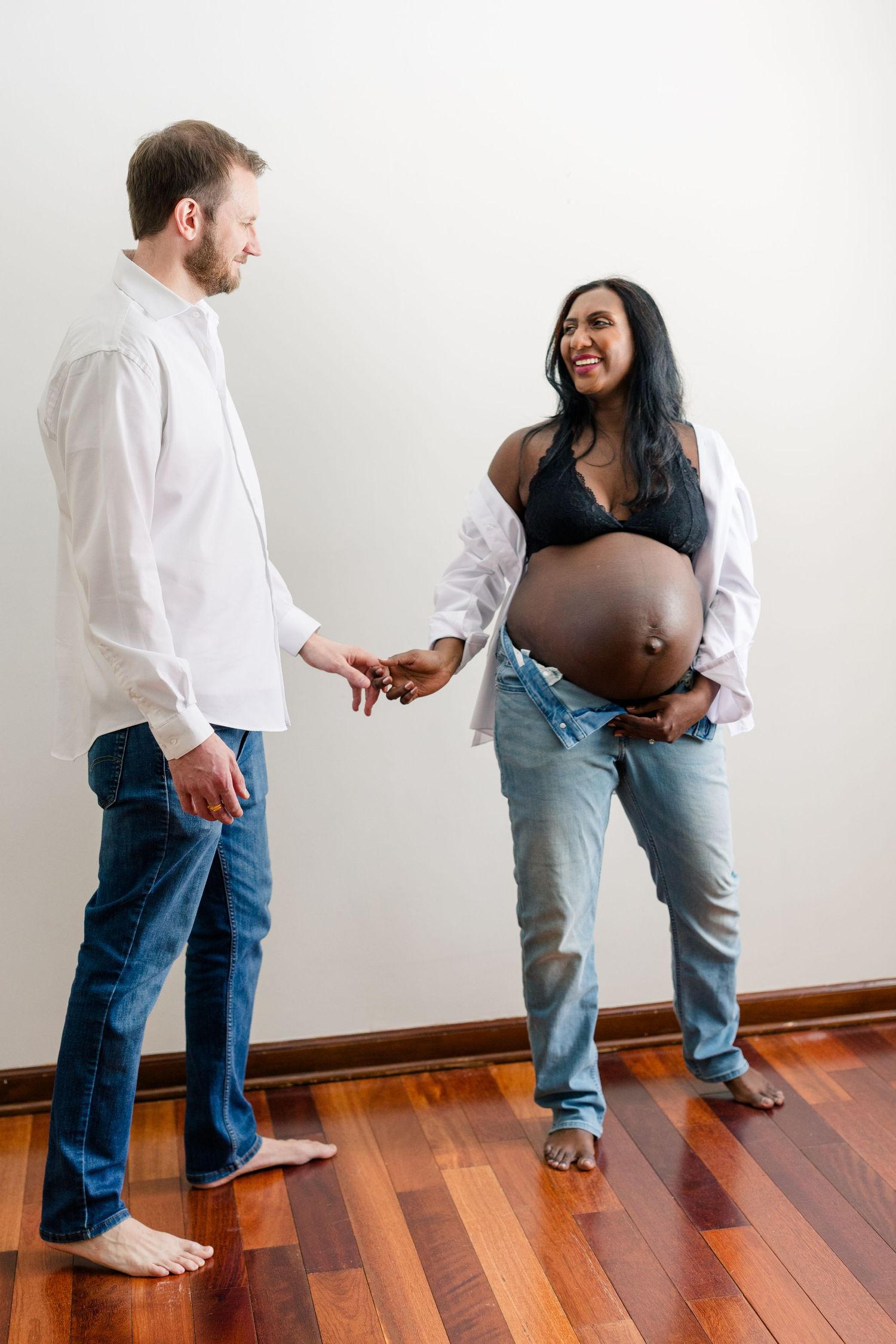 A sequence of photos showing a couple dancing together on a hardwood floor against a white wall.