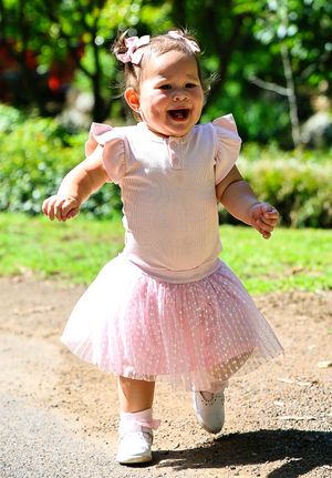 A young girl joyfully running