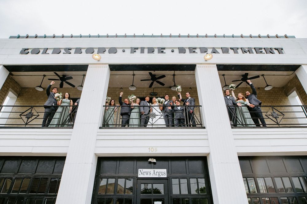 Modern office building interior with white columns and glass walls features contemporary architectural design elements.