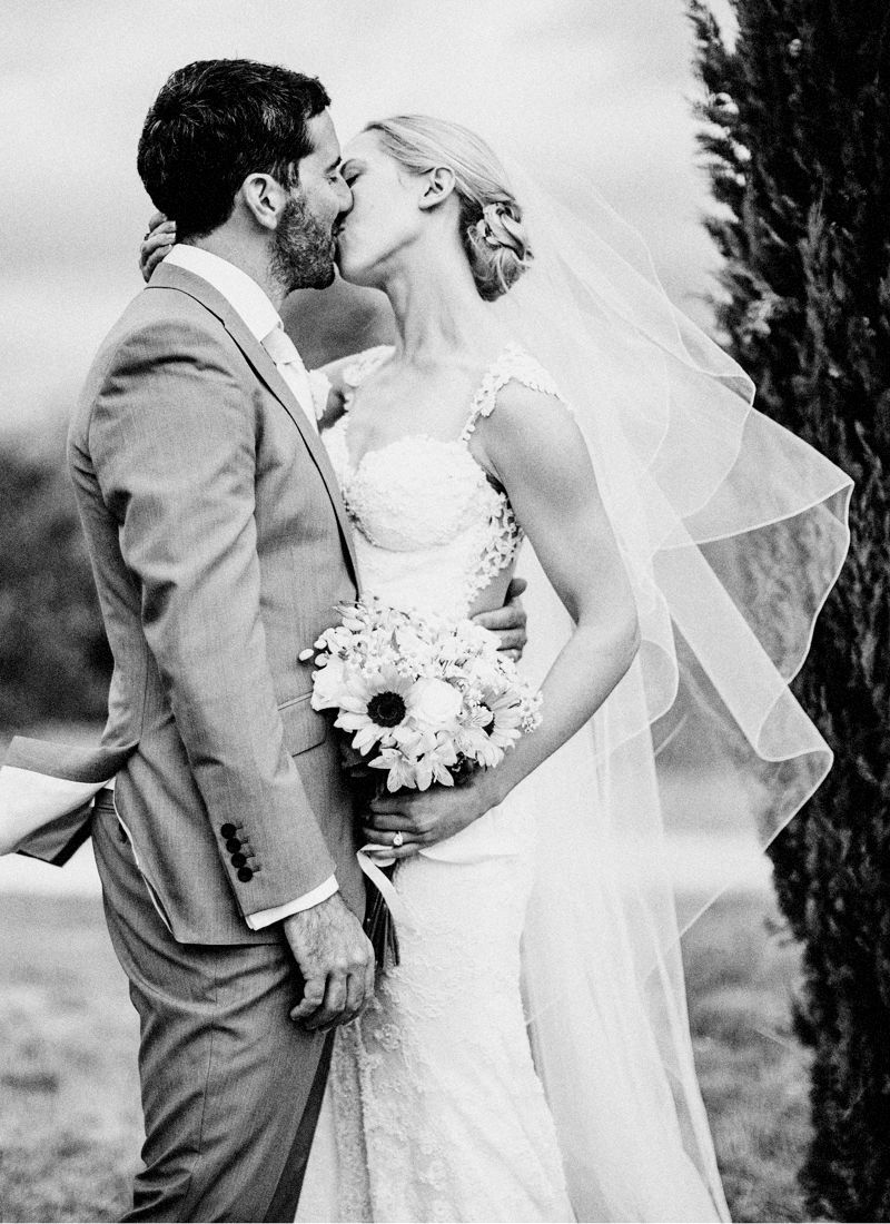 Bride and groom kissing during destination wedding at Comptoir Saint-Hilaire Provence