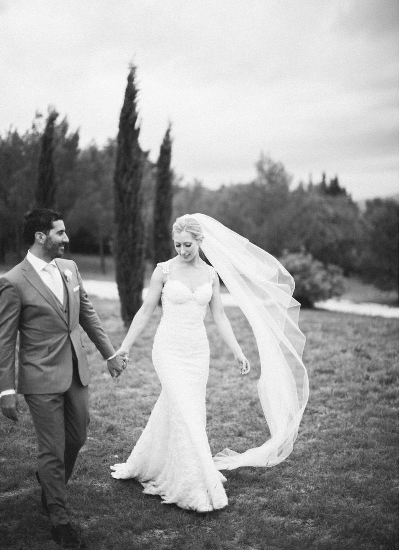 Bride and groom walking through garden at Comptoir Saint-Hilaire Provence wedding venue