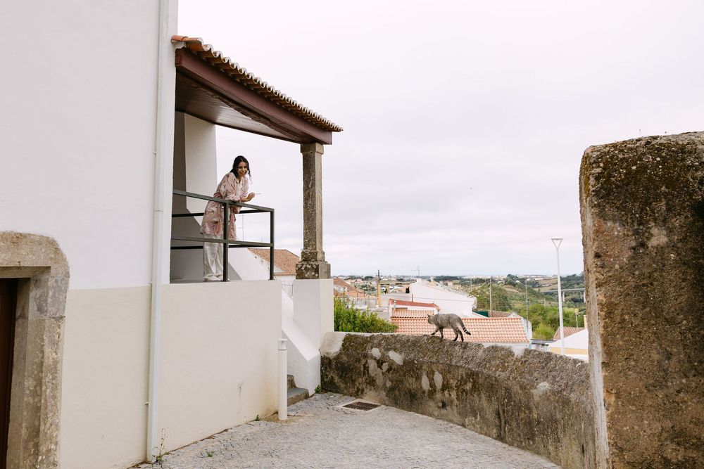 Bride getting ready in a charming local accommodation in Mafra near Lisbon.