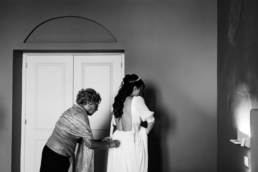 Emotional moment between bride and close family during morning preparations