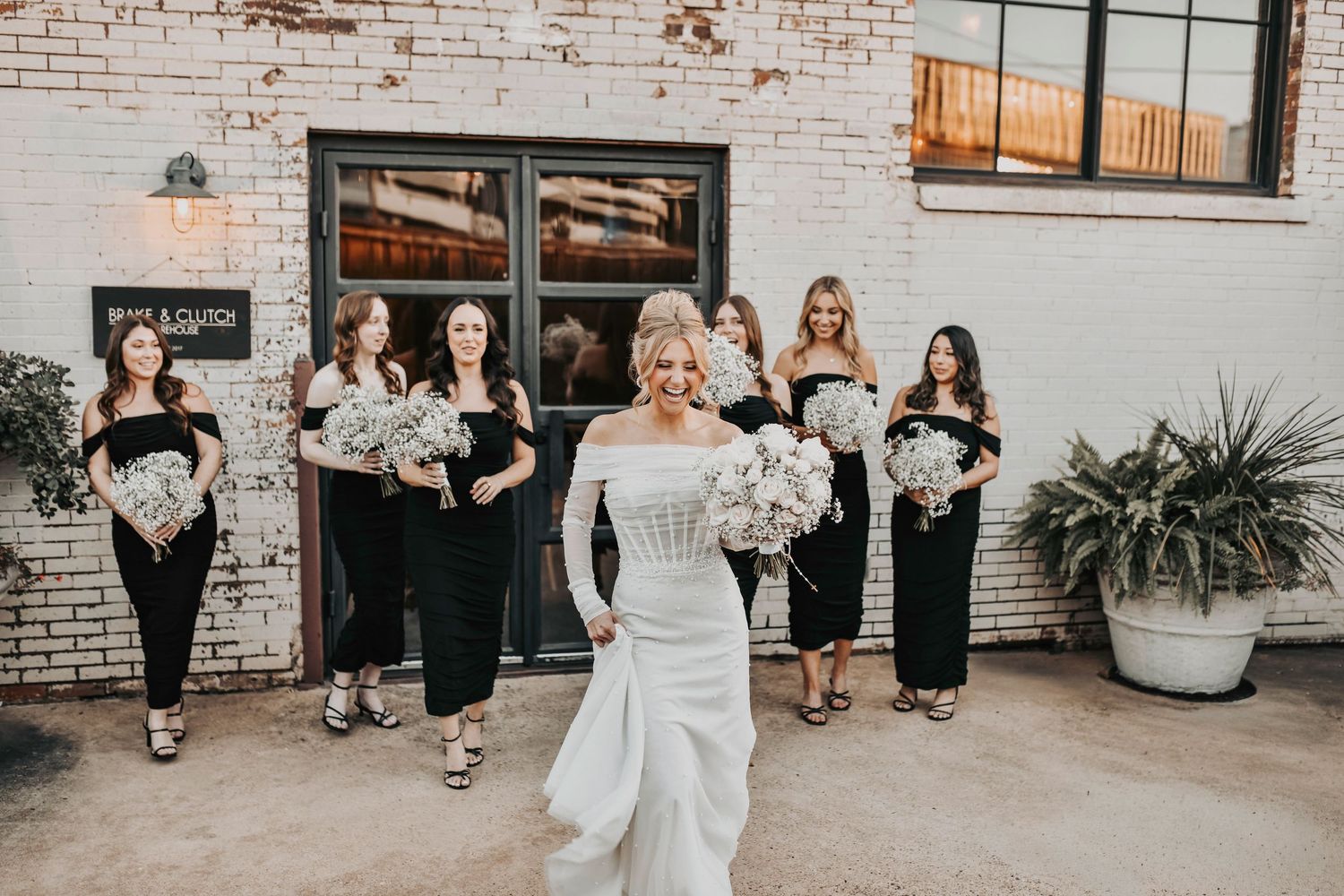 Golden-hour bridal party moment, natural smiles and modern styling illuminated by a warm Dallas sunset