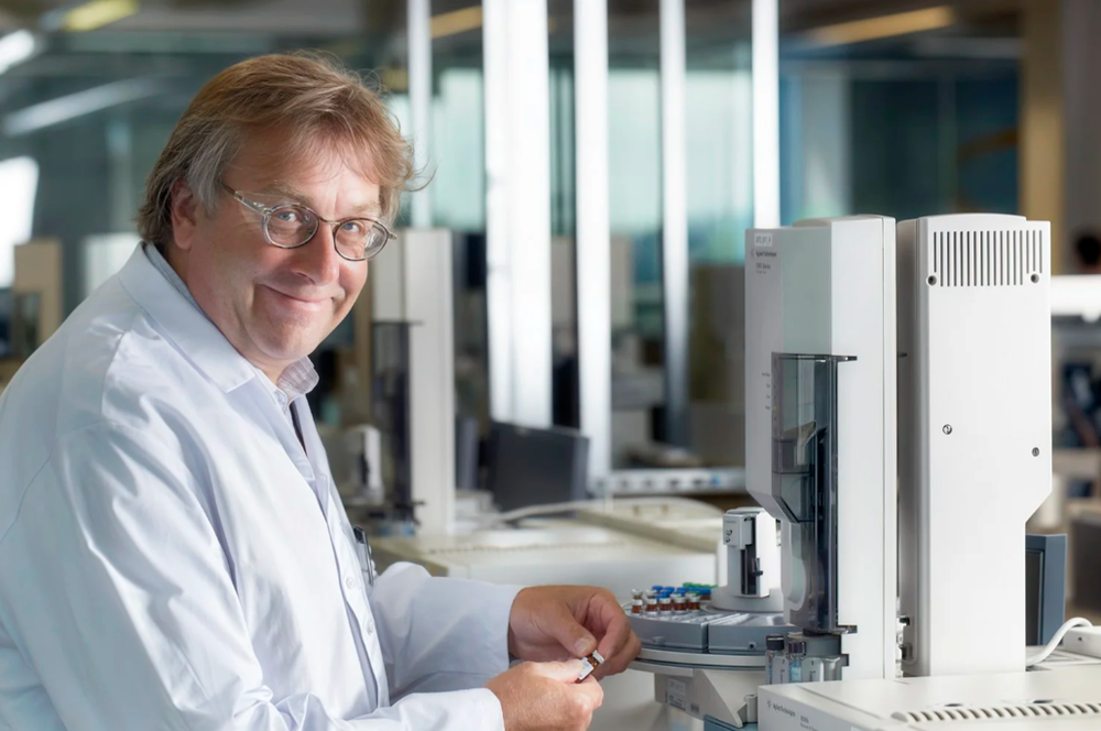 Scientists working in a modern laboratory with specialized equipment.