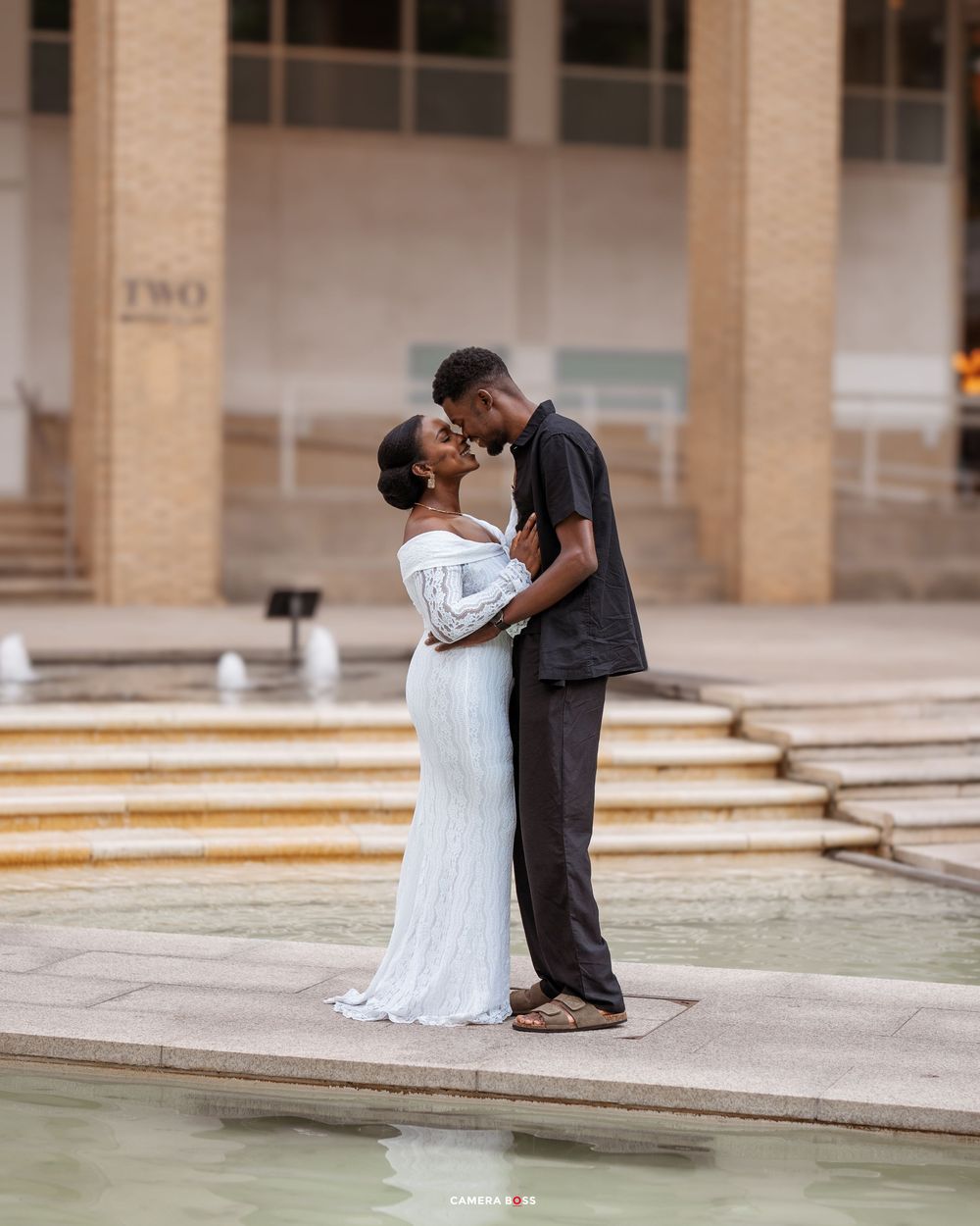 A romantic wedding photoshoot sequence showing a couple in formal attire embracing on stone steps.