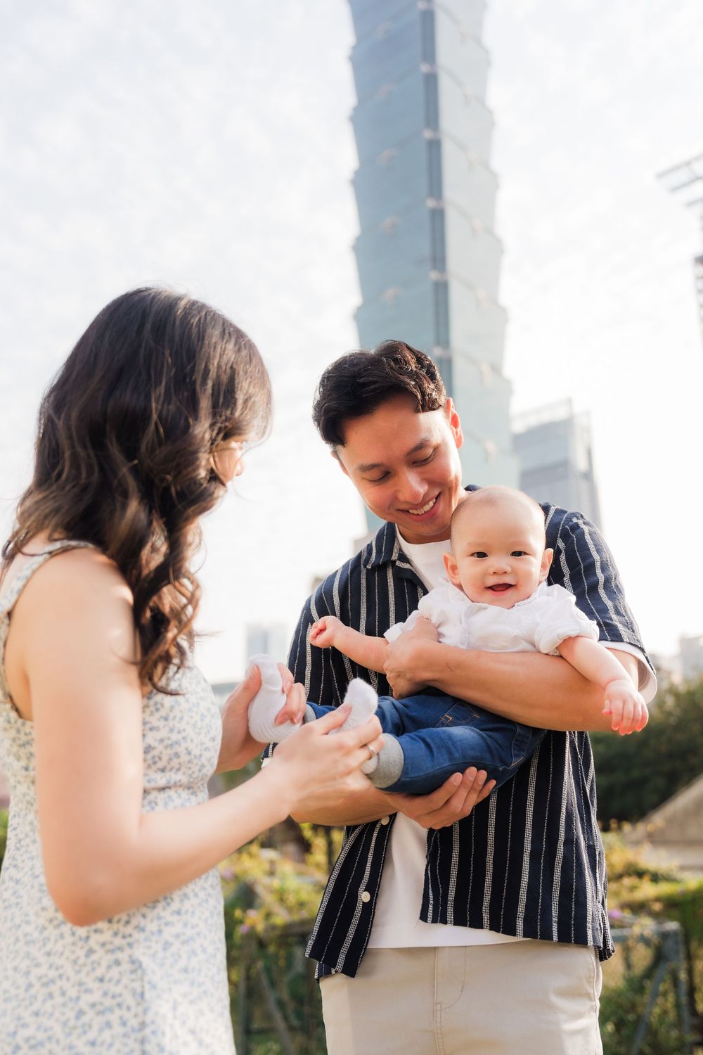 A series of tender moments with a baby against a light background.