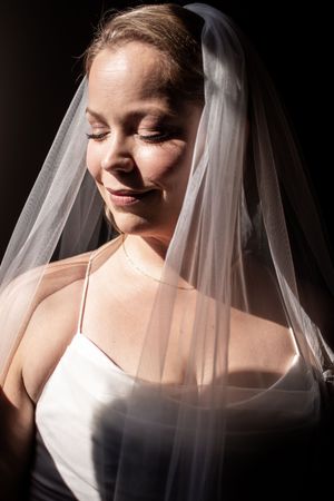 A series of artistic bridal portraits showing a bride in a white veil with dramatic lighting and shadows.