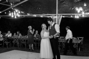 A series of black and white wedding reception photos showing dancing and celebration under string lights at night.