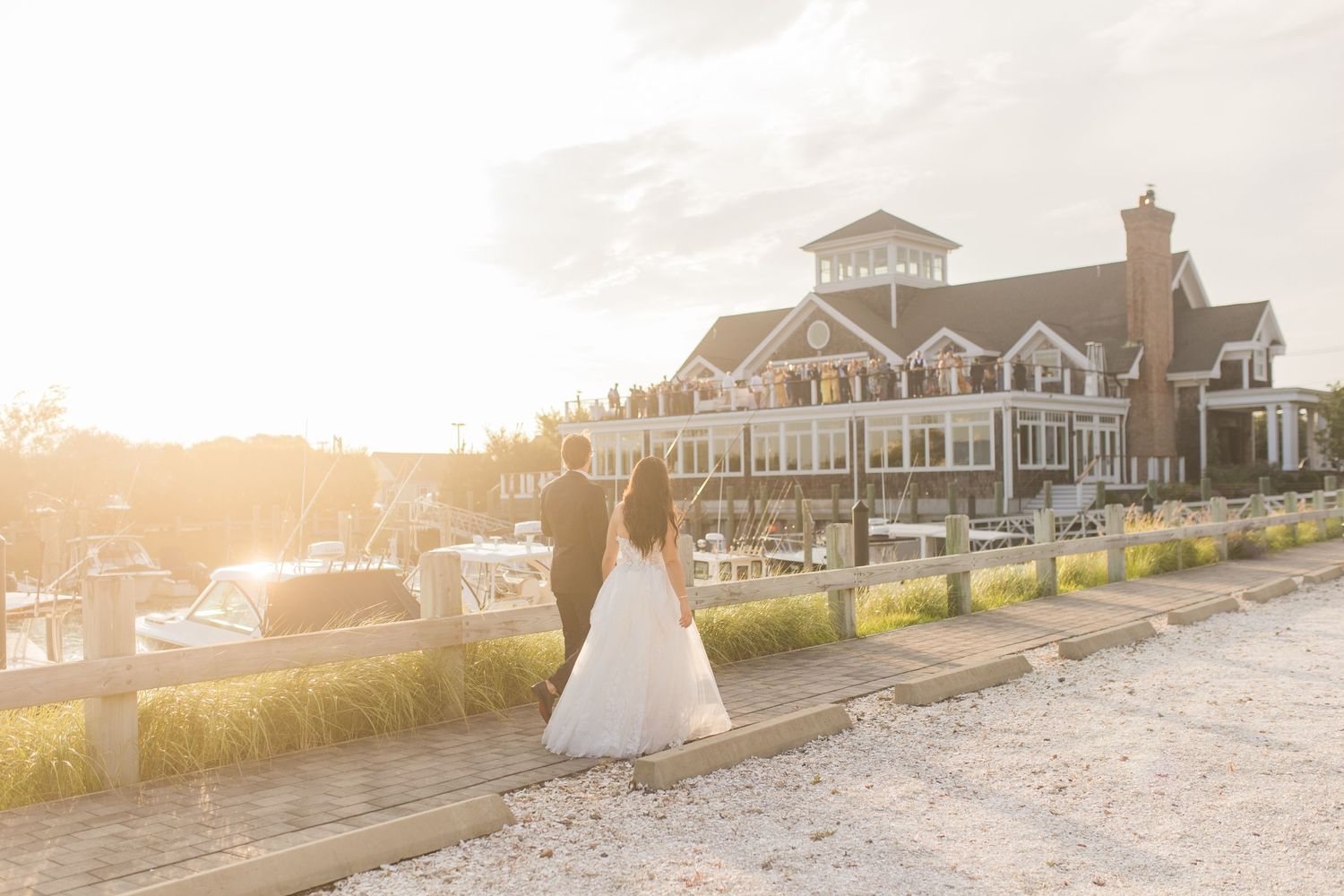 Beachfront venue at sunset with coastal architecture and golden light.